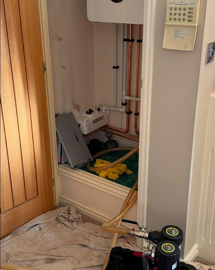 System flush and boiler service work with dust sheets and magnetic filters